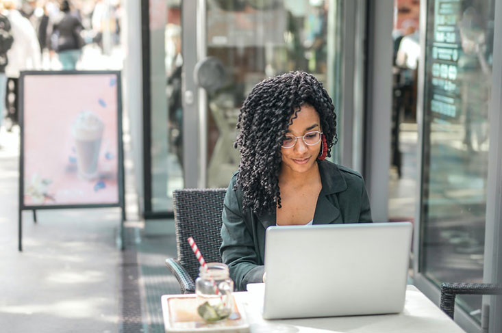 Black-Woman-Working-On-Laptop Young queer girl doing online therapy