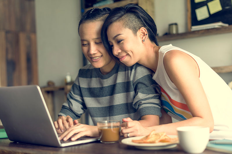 Lesbian couple on laptop